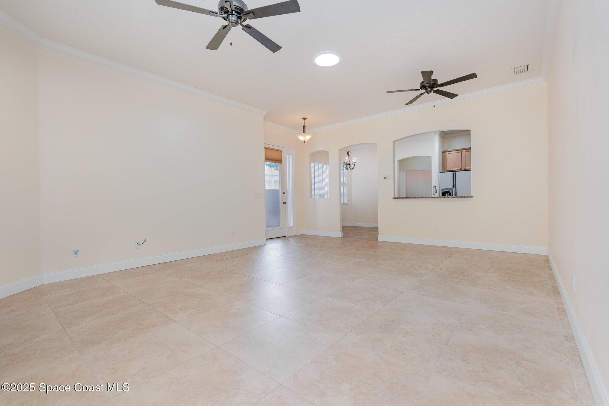 4150 Alamanda Key Drive Melbourne, FL 32901 - Photo 10 of 65 a view of a livingroom with a ceiling fan and hardwood floor