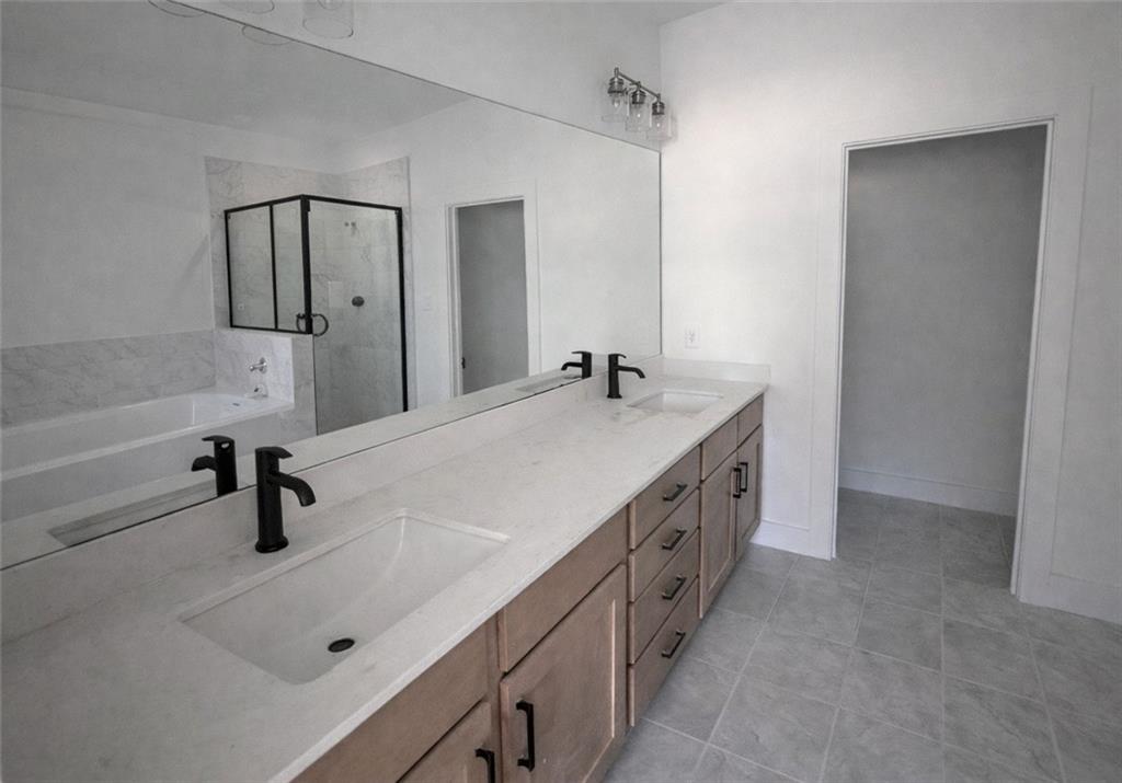 287 Bell Grove Lane Suwanee, GA 30024 - Photo 13 of 29 a bathroom with double vanity and mirrors