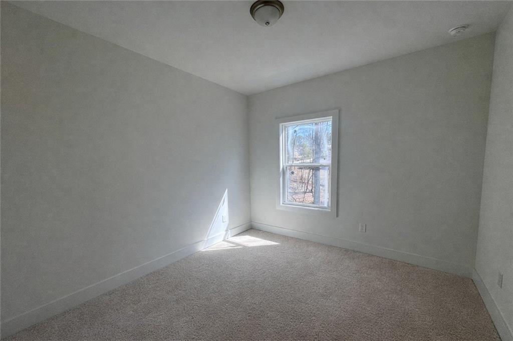 287 Bell Grove Lane Suwanee, GA 30024 - Photo 18 of 29 an empty room with windows