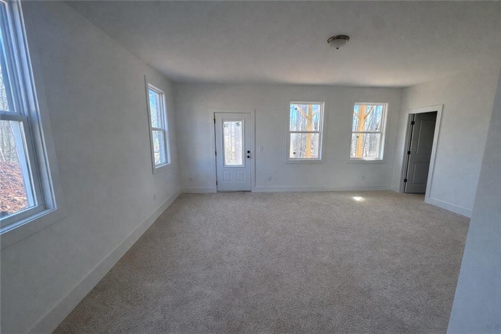 287 Bell Grove Lane Suwanee, GA 30024 - Photo 19 of 29 an empty room with windows