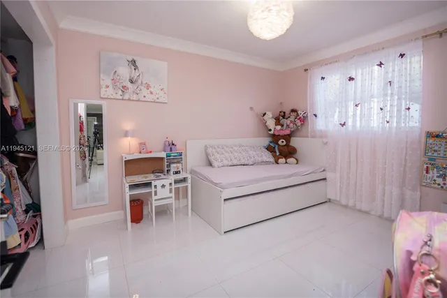 a bed room with a bed and a tv