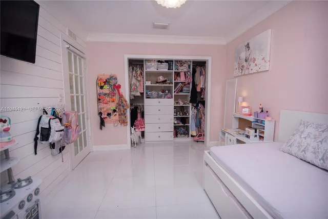 a view of a livingroom with furniture and a flat screen tv