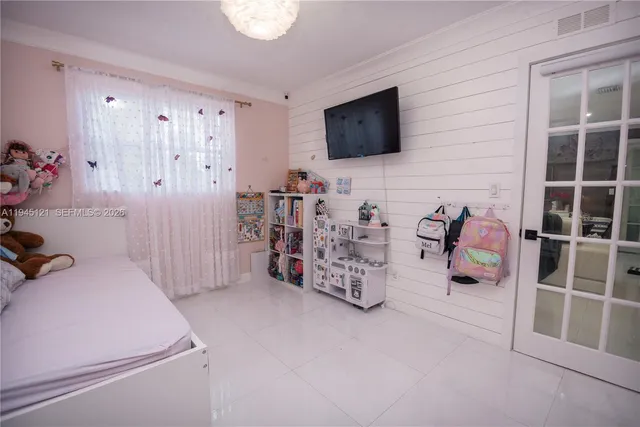 a view of a patio with a dining table and chairs