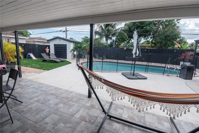 a front view of house with yard and outdoor seating
