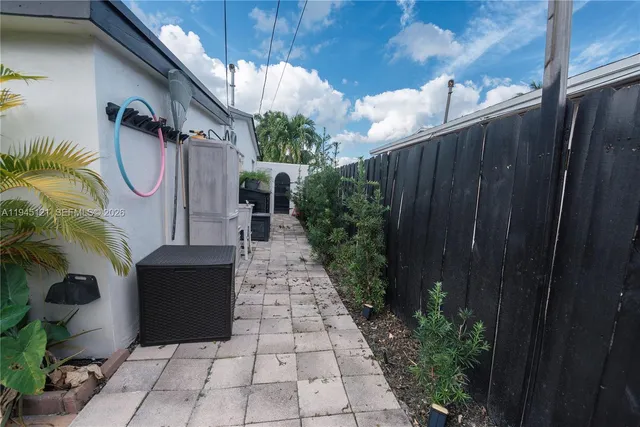 a view of a patio with swimming pool table and chairs