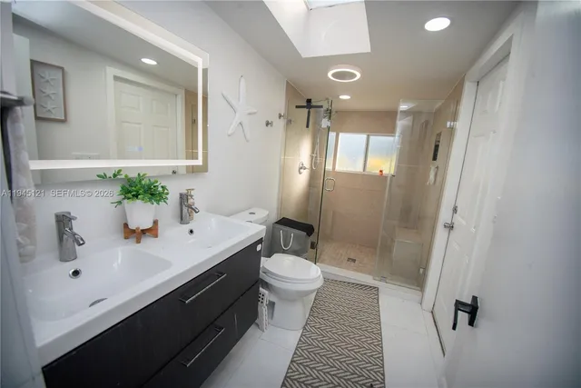 a bathroom with a sink and toilet