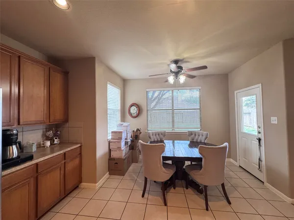 a view of a dining room with furniture and window