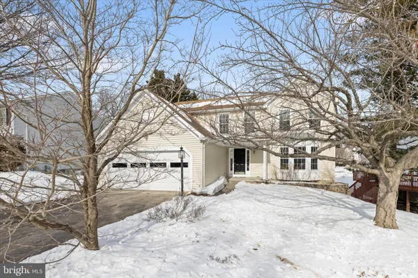 a view of a house with a snow in the yard