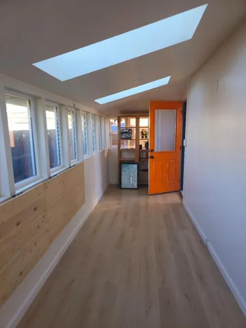 a view of a livingroom with furniture and window