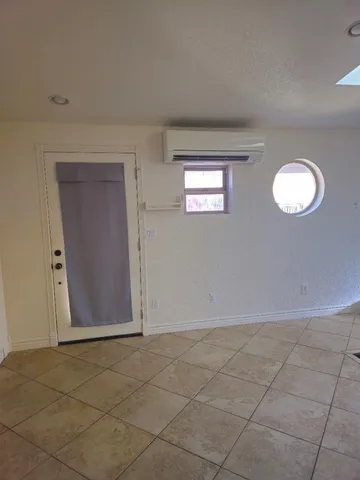 a view of an empty room with a window