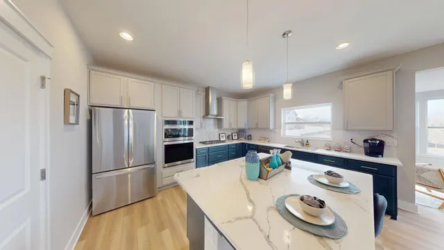 a kitchen with a sink stove top oven and cabinets