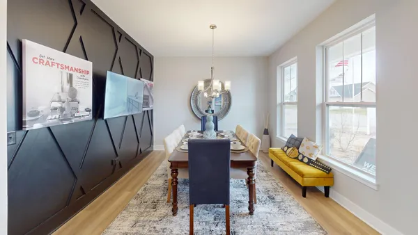 a view of a livingroom with furniture and wooden floor
