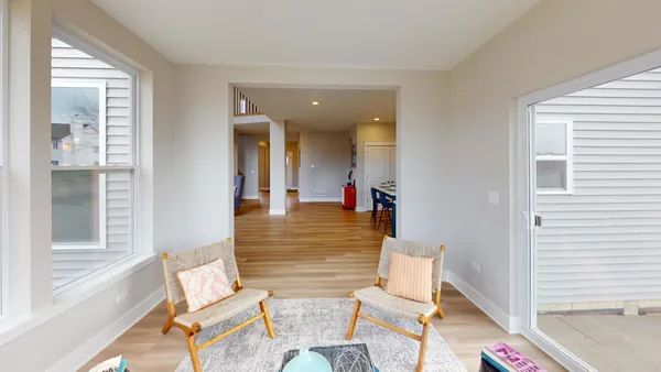 a workspace with furniture and wooden floor