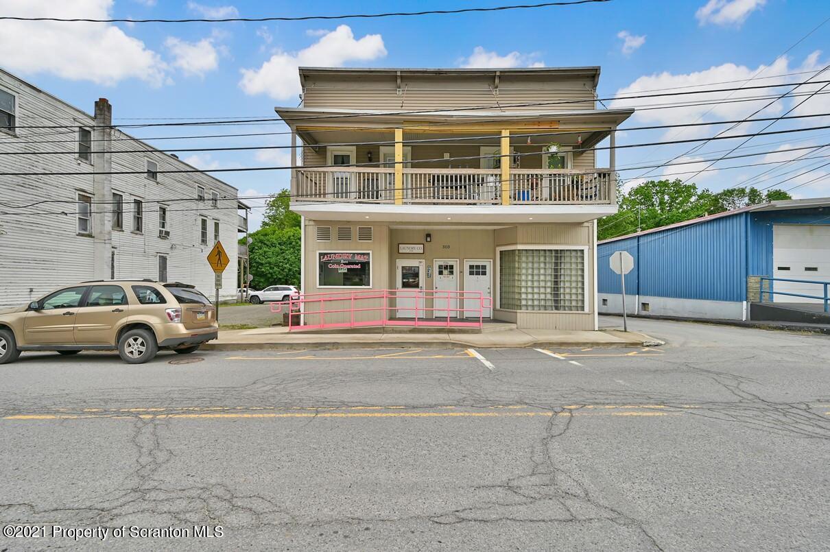 303 Main Street Nicholson, PA 18446 - Photo 1 of 98 a view of a car park in front of a building