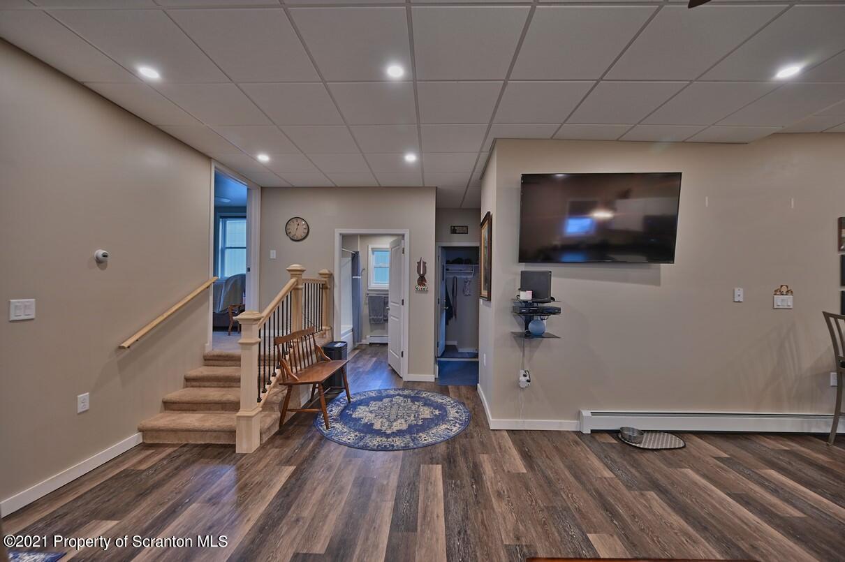 303 Main Street Nicholson, PA 18446 - Photo 13 of 98 a living room with furniture and a flat screen tv