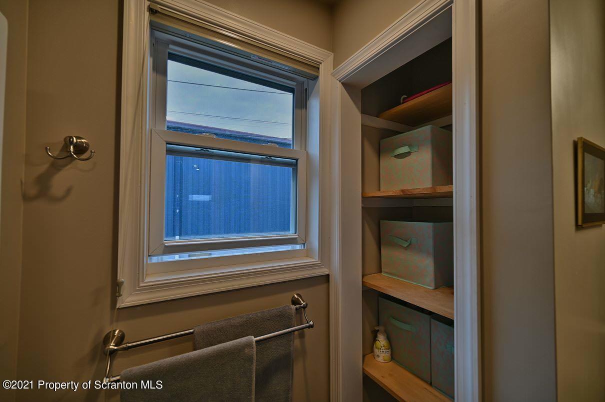 303 Main Street Nicholson, PA 18446 - Photo 23 of 98 a bathroom with a sink and a mirror