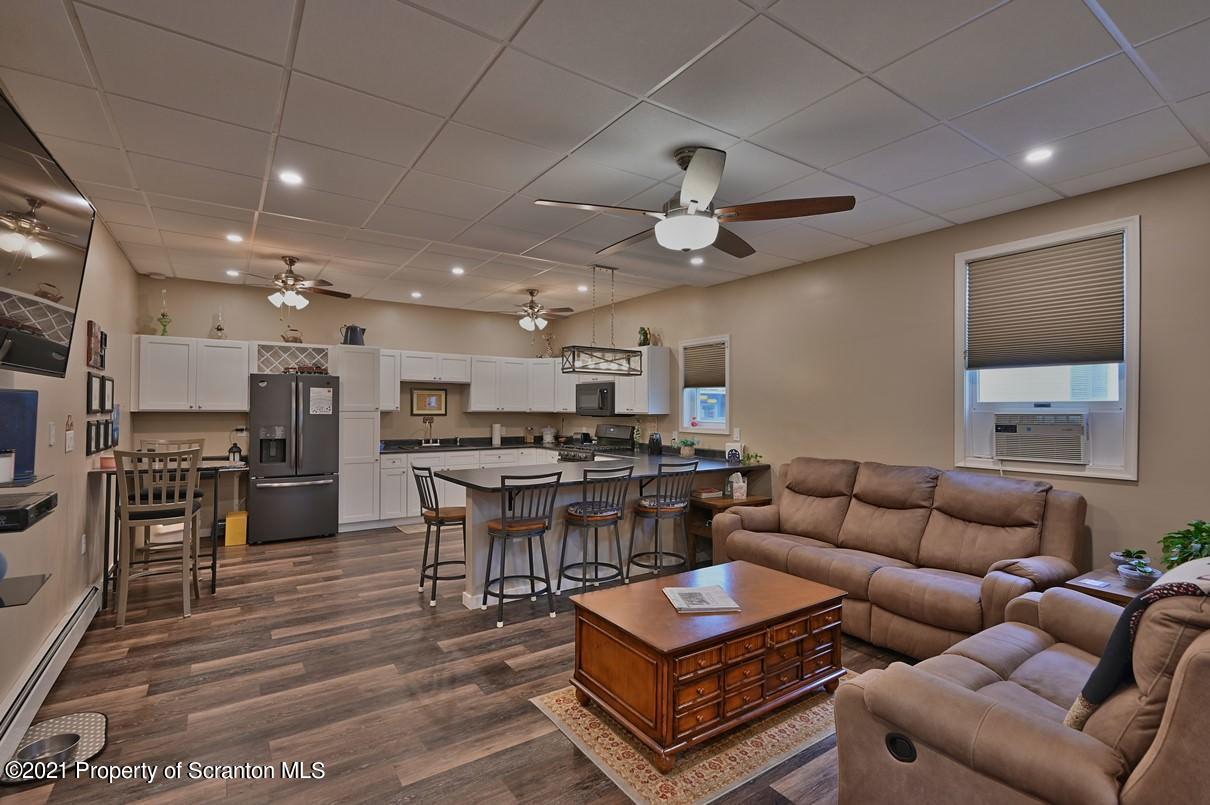 303 Main Street Nicholson, PA 18446 - Photo 3 of 98 a living room with furniture kitchen view and a wooden floor