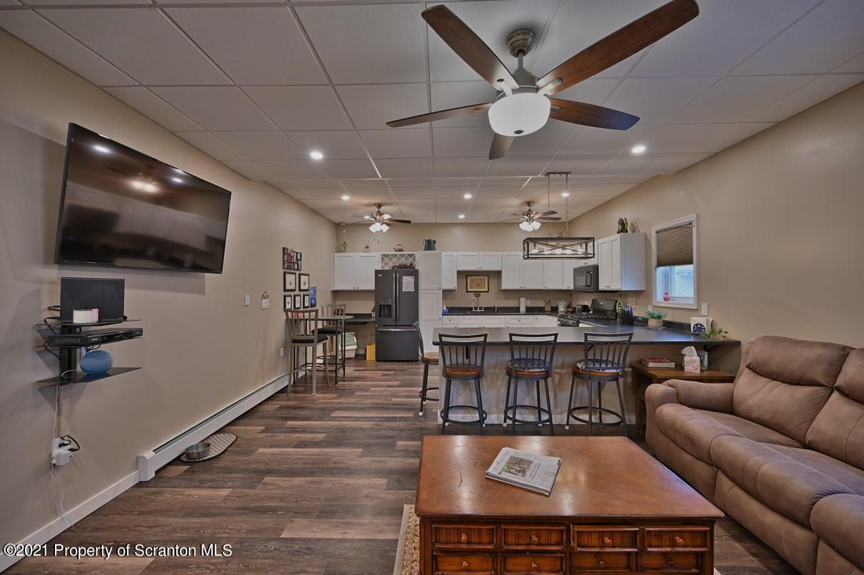 303 Main Street Nicholson, PA 18446 - Photo 4 of 98 a living room with stainless steel appliances furniture and a flat screen tv