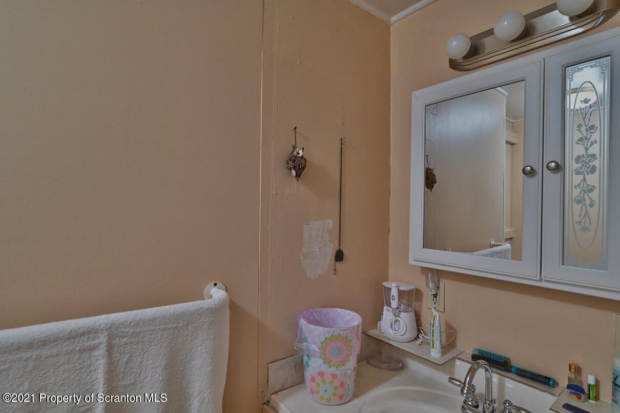 303 Main Street Nicholson, PA 18446 - Photo 48 of 98 a bathroom with a granite countertop bathtub shower sink and toilet