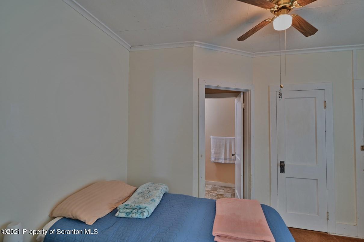 303 Main Street Nicholson, PA 18446 - Photo 50 of 98 a room with a bed and a ceiling fan