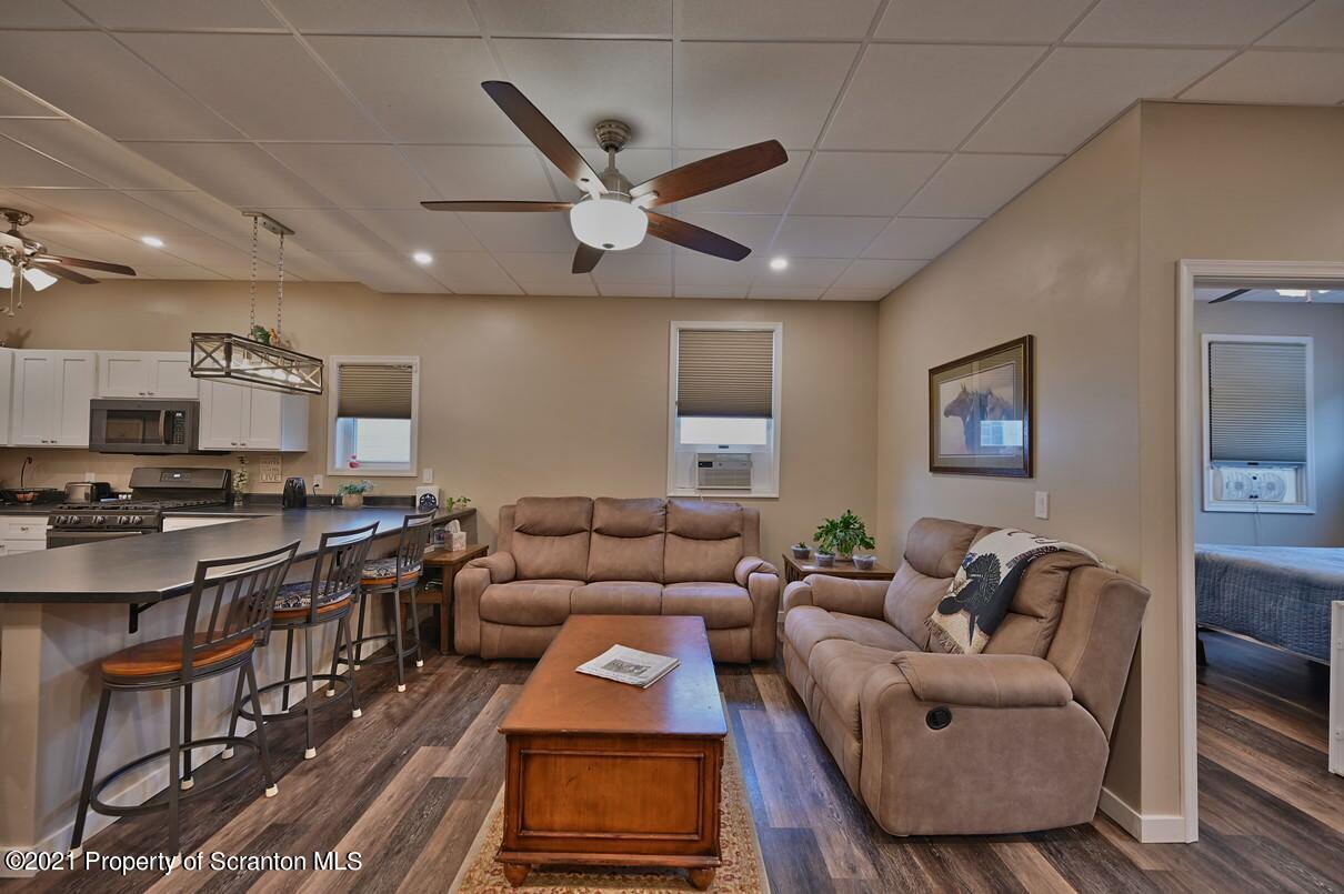 303 Main Street Nicholson, PA 18446 - Photo 5 of 98 a living room with furniture and a wooden floor