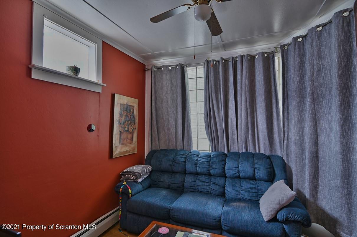 303 Main Street Nicholson, PA 18446 - Photo 51 of 98 a living room with furniture and a wooden door
