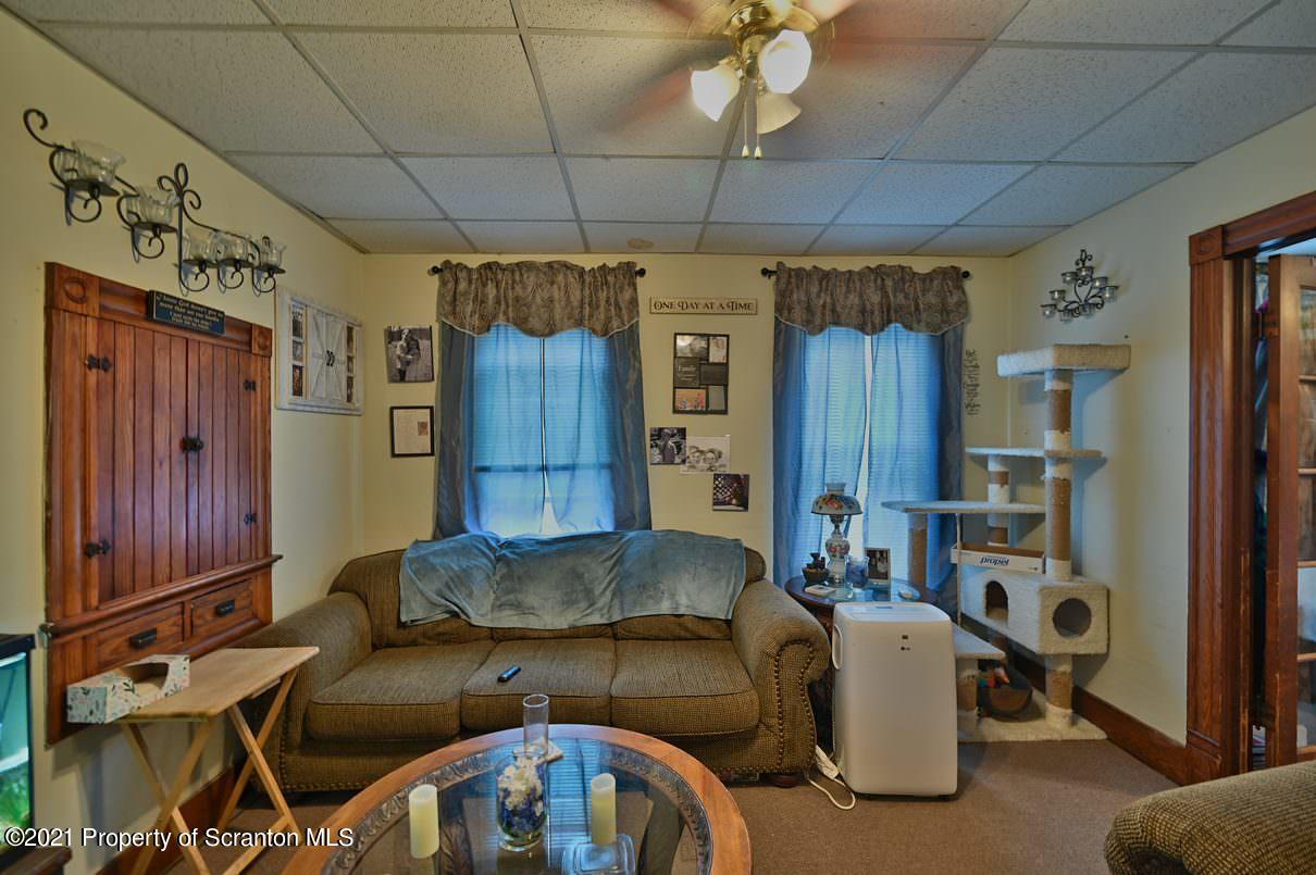 303 Main Street Nicholson, PA 18446 - Photo 58 of 98 a living room with furniture a ceiling fan and a window