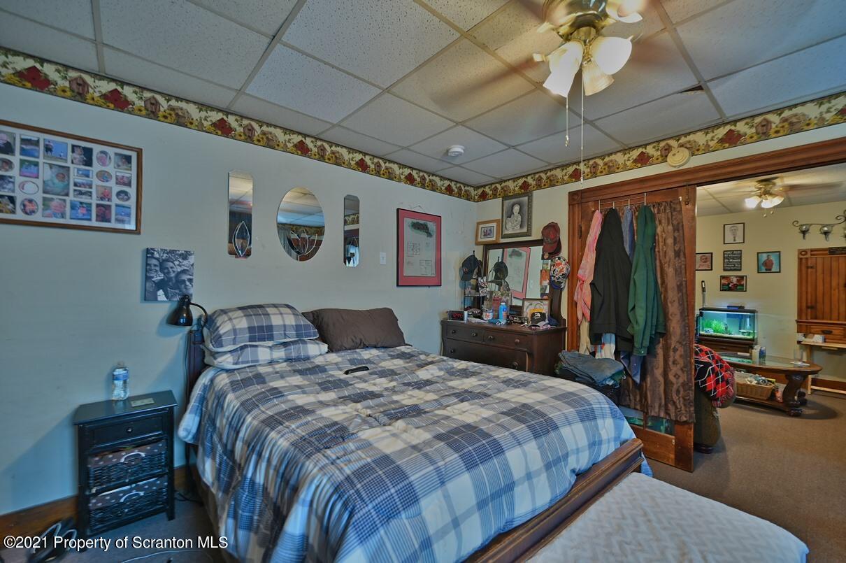 303 Main Street Nicholson, PA 18446 - Photo 60 of 98 a bed room with a bed and a walk in closet