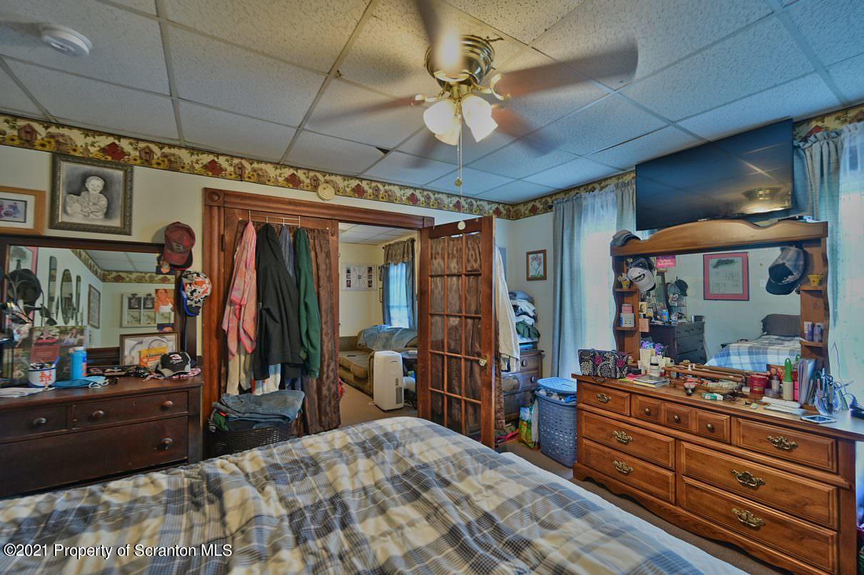 303 Main Street Nicholson, PA 18446 - Photo 61 of 98 a room with lots of wooden furniture and a large mirror