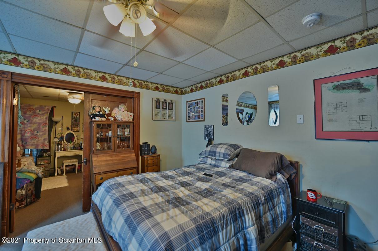 303 Main Street Nicholson, PA 18446 - Photo 62 of 98 a bedroom with a bed and wooden floor