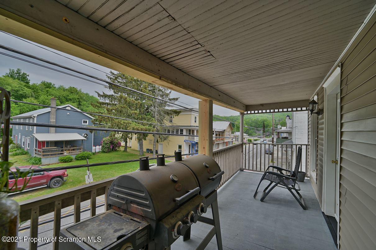303 Main Street Nicholson, PA 18446 - Photo 66 of 98 a view of yard from deck with patio