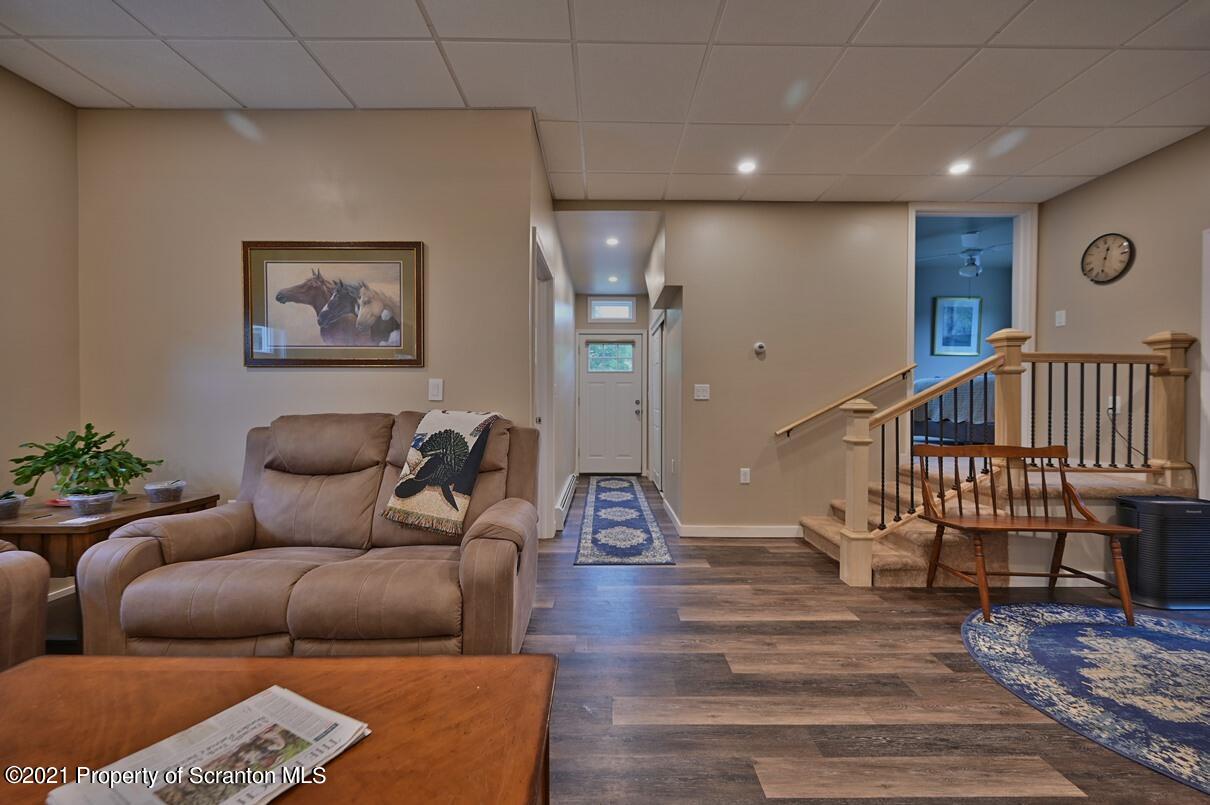 303 Main Street Nicholson, PA 18446 - Photo 7 of 98 a living room with furniture and wooden floor