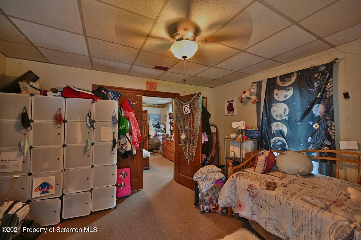 303 Main Street Nicholson, PA 18446 - Photo 76 of 98 a bed room with a bed and a walk in closet