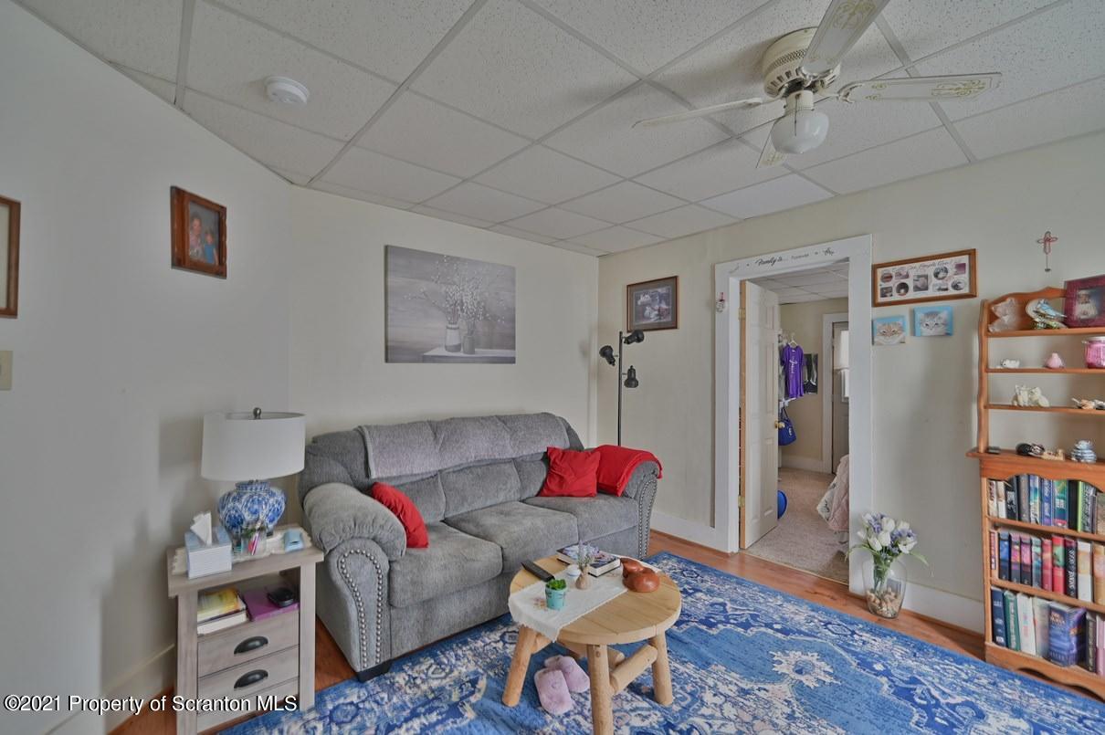 303 Main Street Nicholson, PA 18446 - Photo 81 of 98 a living room with furniture and a book shelf