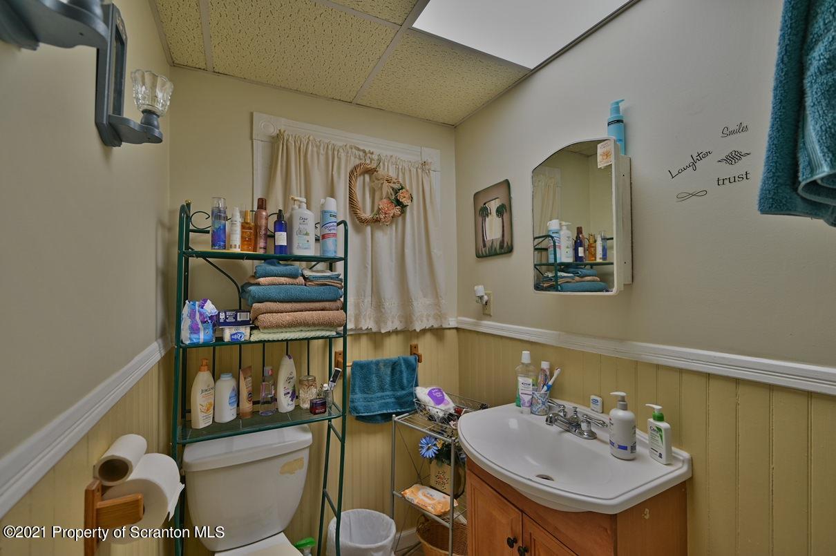 303 Main Street Nicholson, PA 18446 - Photo 92 of 98 a bathroom with a sink and a mirror