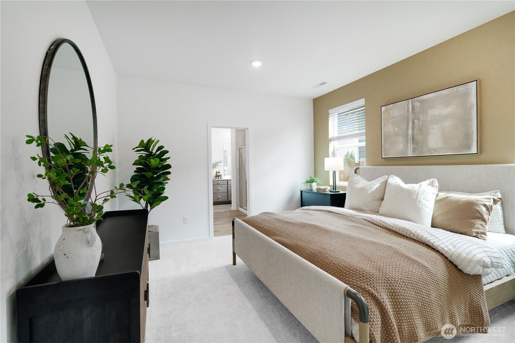 114 Moonshadow Lane Sequim, WA 98382 - Photo 13 of 27 a bedroom with a bed and a potted plant