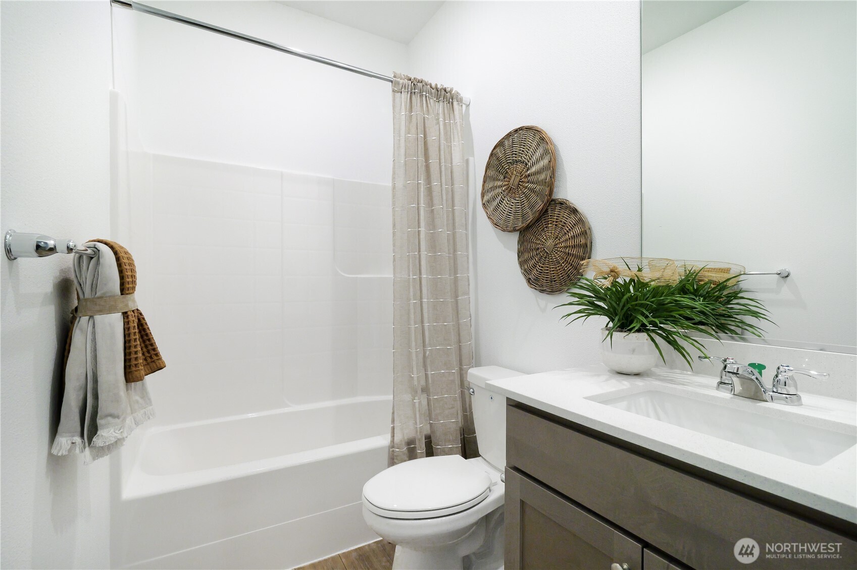 114 Moonshadow Lane Sequim, WA 98382 - Photo 22 of 27 a bathroom with a sink a toilet and a mirror