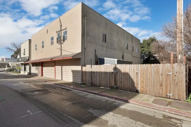 an aerial view of a city with ocean view