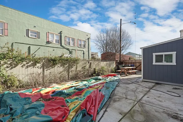 a kitchen with a sink a stove and chairs
