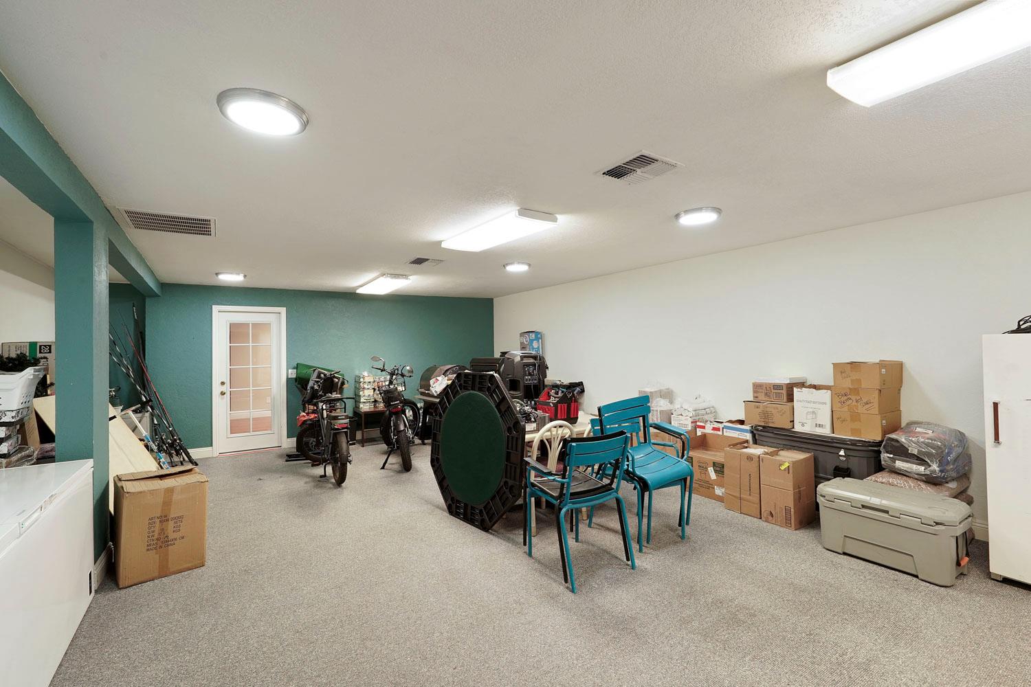 14144 Market Street Walnut Grove, CA 95690 - Photo 52 of 86 a living room with furniture and a flat screen tv