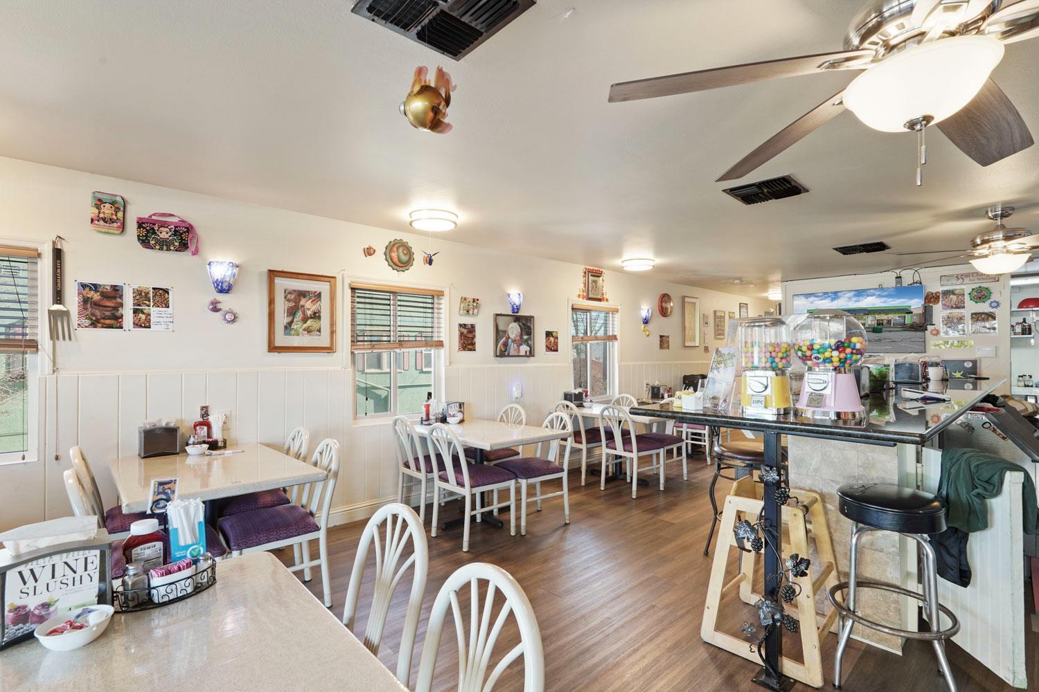 14144 Market Street Walnut Grove, CA 95690 - Photo 80 of 86 a living room with lots of furniture and kitchen view