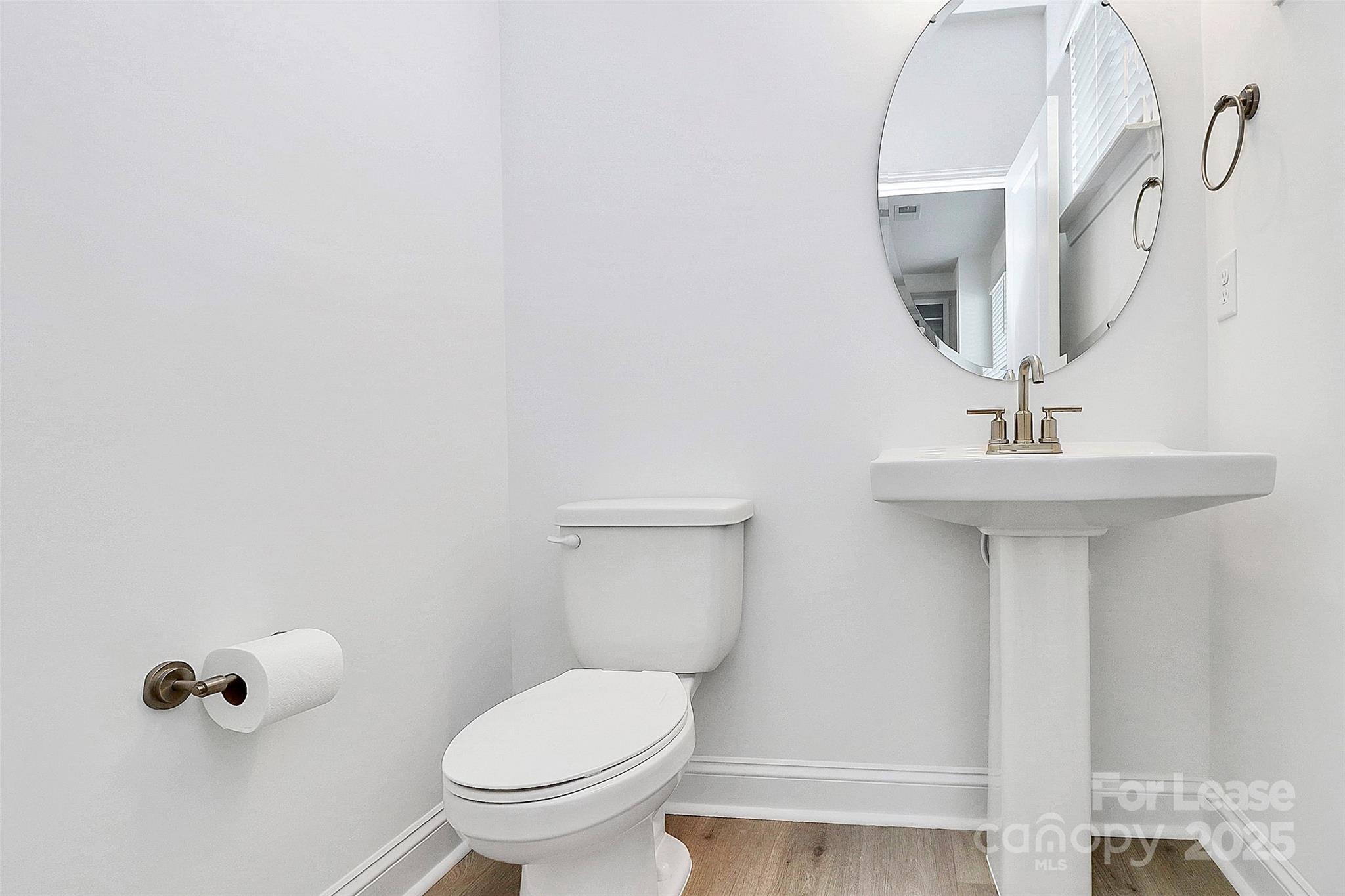 707 Hoke Lane Davidson, NC 28036 - Photo 12 of 27 a bathroom with a sink toilet and a mirror