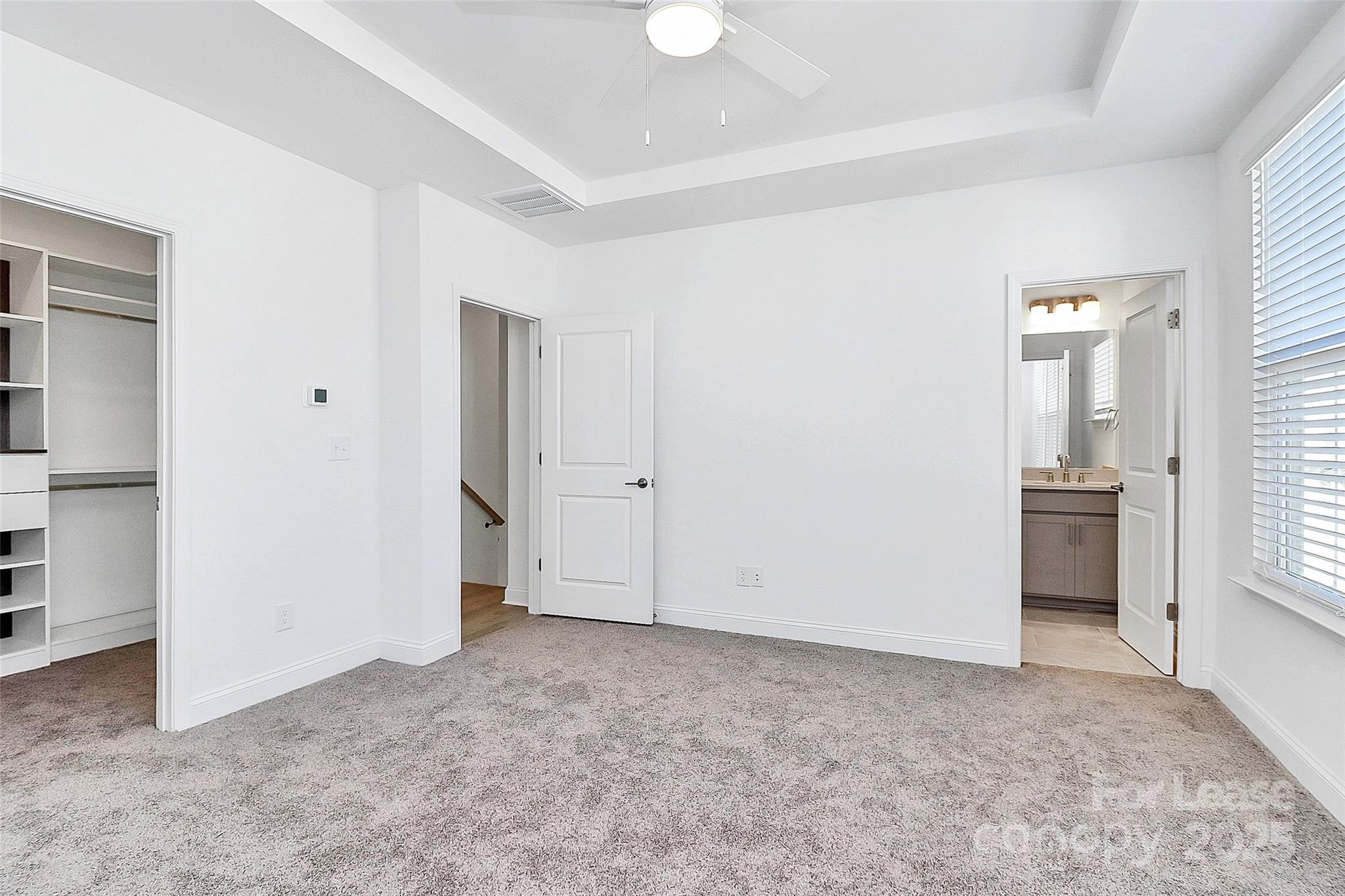 707 Hoke Lane Davidson, NC 28036 - Photo 15 of 27 an empty room with closet and a bathroom