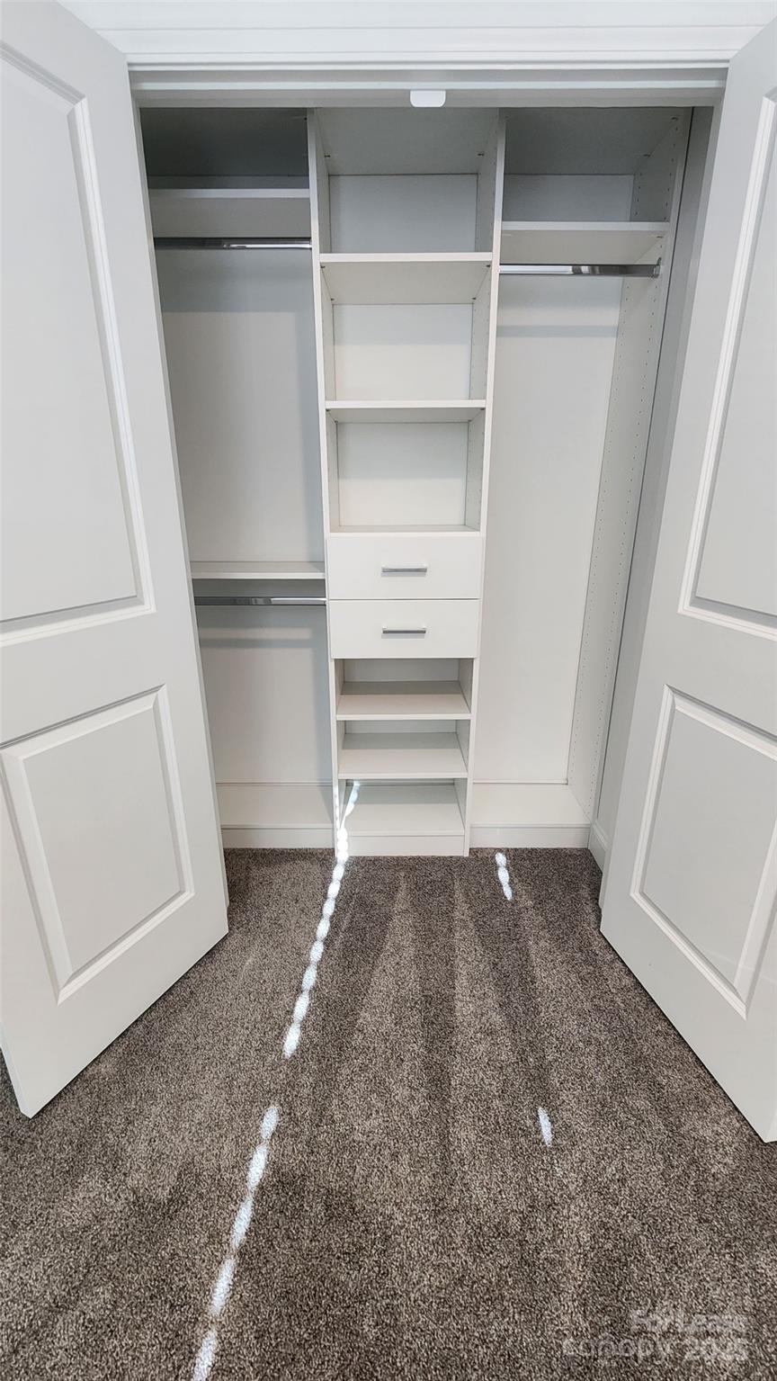 707 Hoke Lane Davidson, NC 28036 - Photo 24 of 27 a view of walk in closet with empty racks