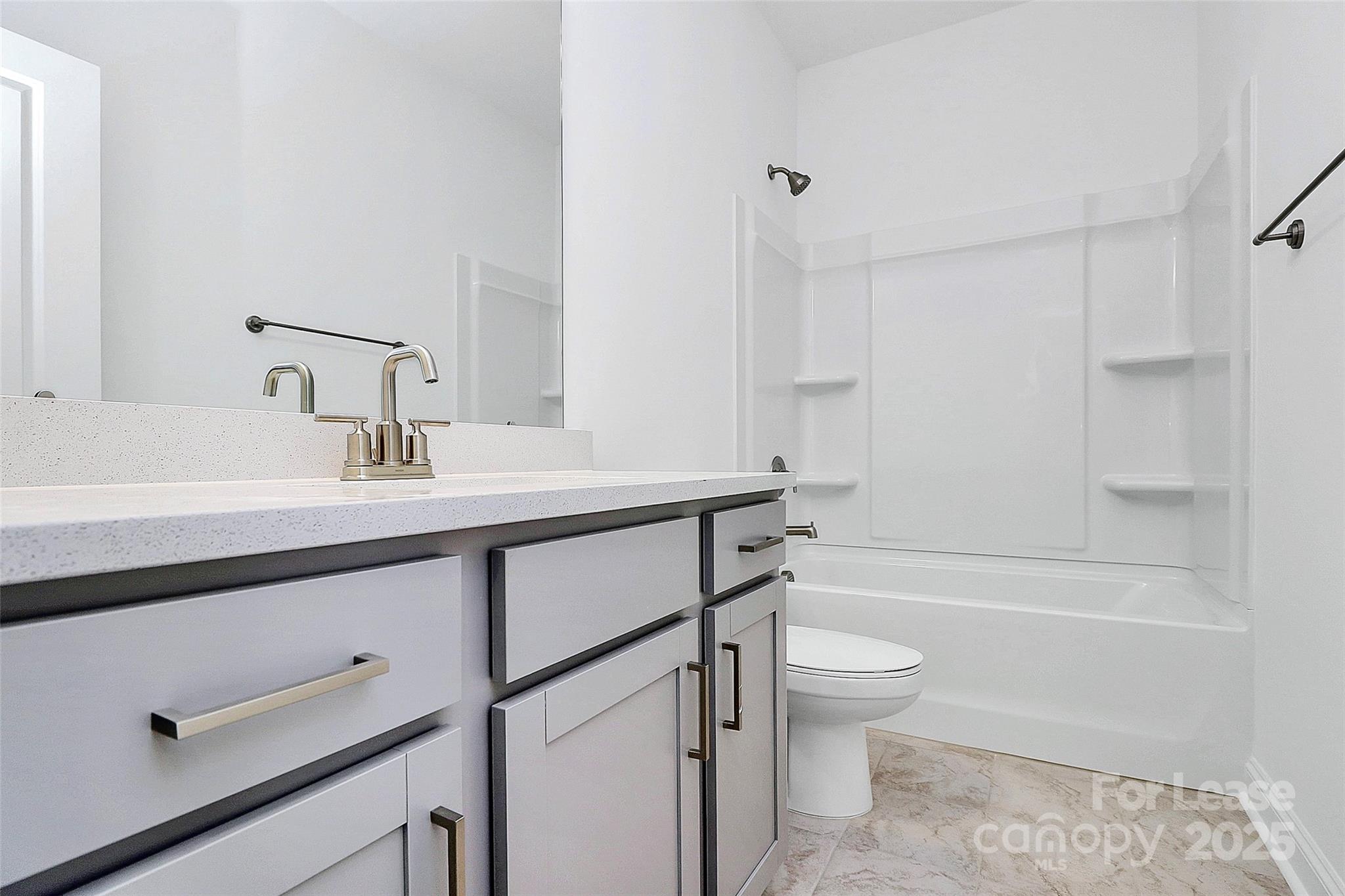 707 Hoke Lane Davidson, NC 28036 - Photo 25 of 27 a bathroom with a sink a toilet and a bathtub