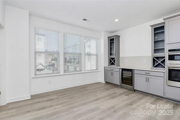 a kitchen with a stove oven and sink