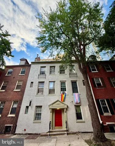 a front view of residential houses with yard