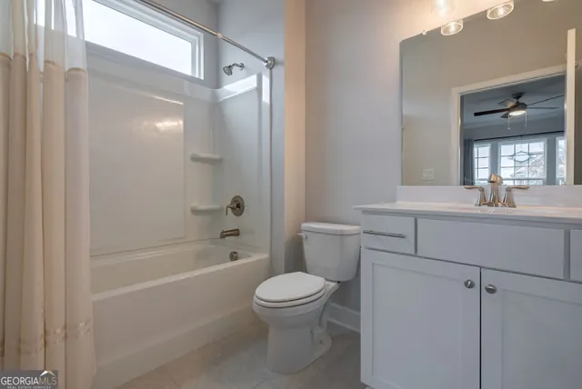 a bed room with a bed and a television