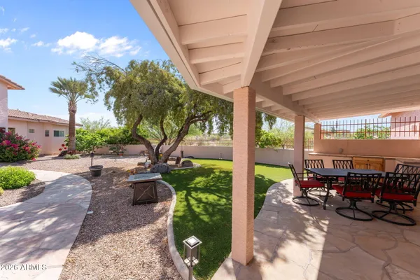 a kitchen with granite countertop a sink stove and cabinets