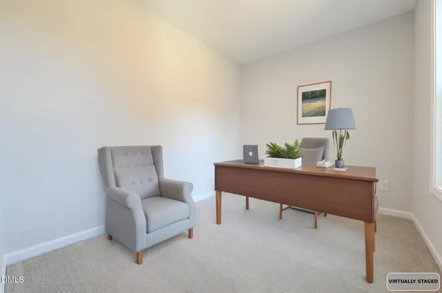 a living room with furniture and a chair